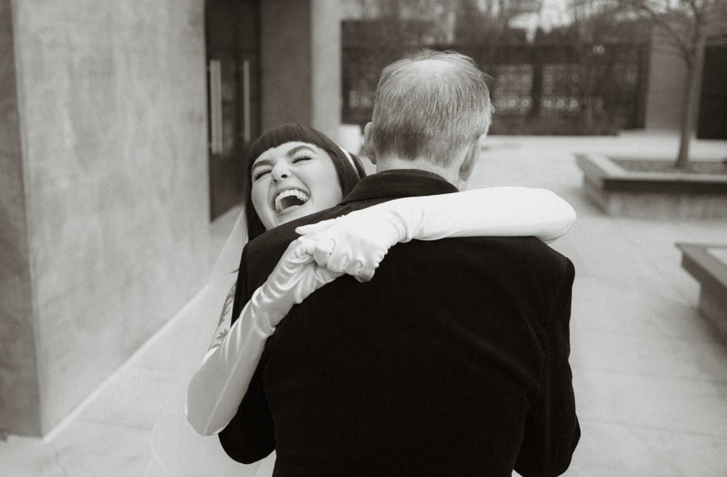 Emotional first look between bride and father inside Clementine Hall